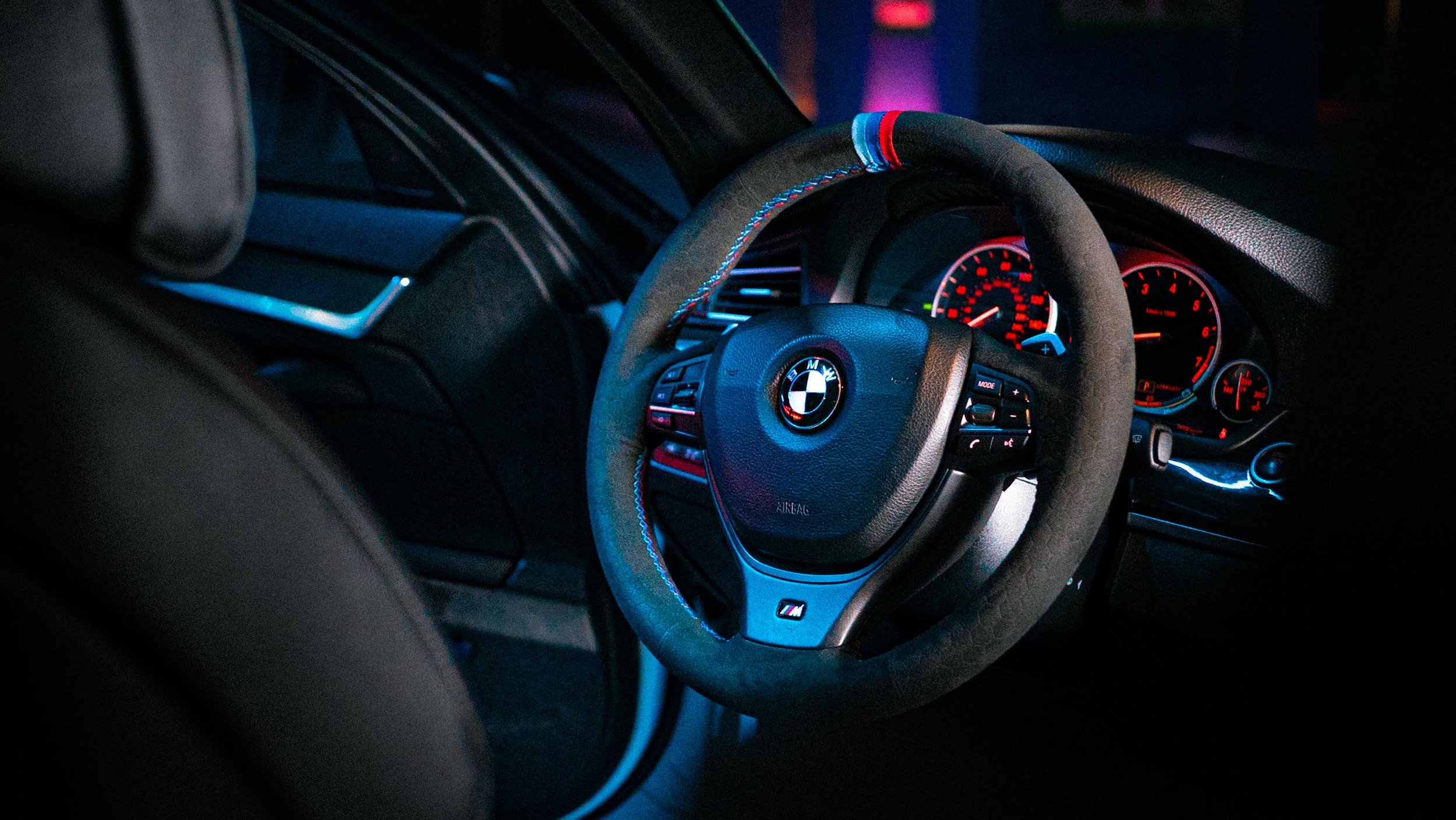 Custom suede BMW M steering wheel detailed at Agathos Motors Lab