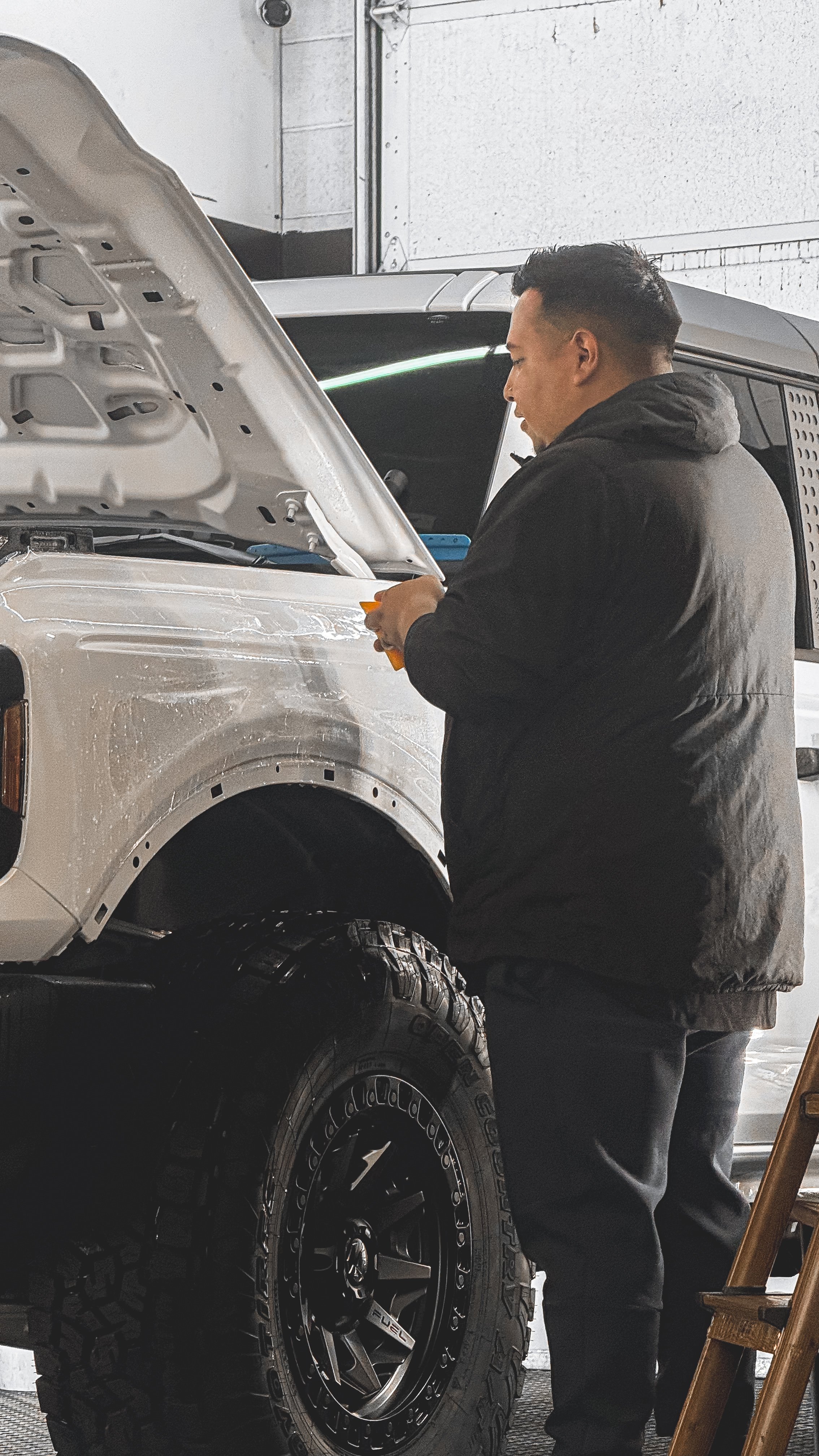 White Bronco front end with paint protection film installed